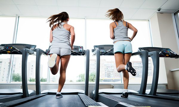 Girls Running on Treadmill at Gym