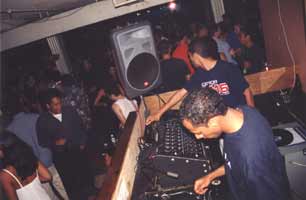 DJ at a nightclub bar