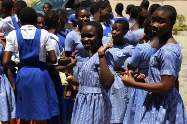 School girls in blue dresses