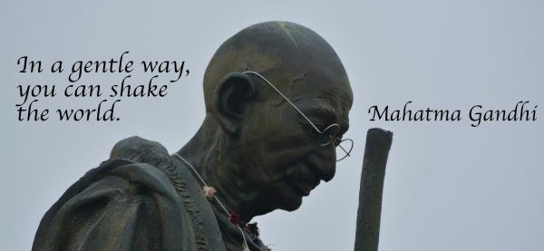 Statue of Mahatma Ghandi with quote In a gentle way, you can shake the world