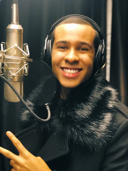 Anthony Brown in front of studio microphone