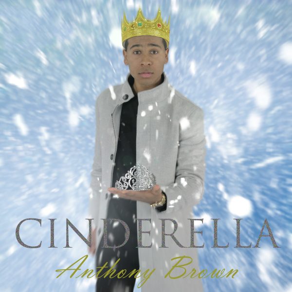 Anthony Brown wears gold crown and holds glass slipper, Cinderella written in large caps