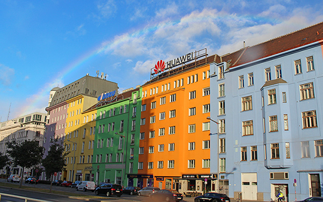 Rainbow over Huawei sign in Vienna, October 2021