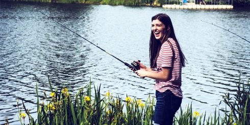 girl fishing lake summer
